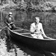 Deux hommes en canot, possiblement sur la rivière Péribonka près du chemin des Passes-Dangereuses au Saguenay
